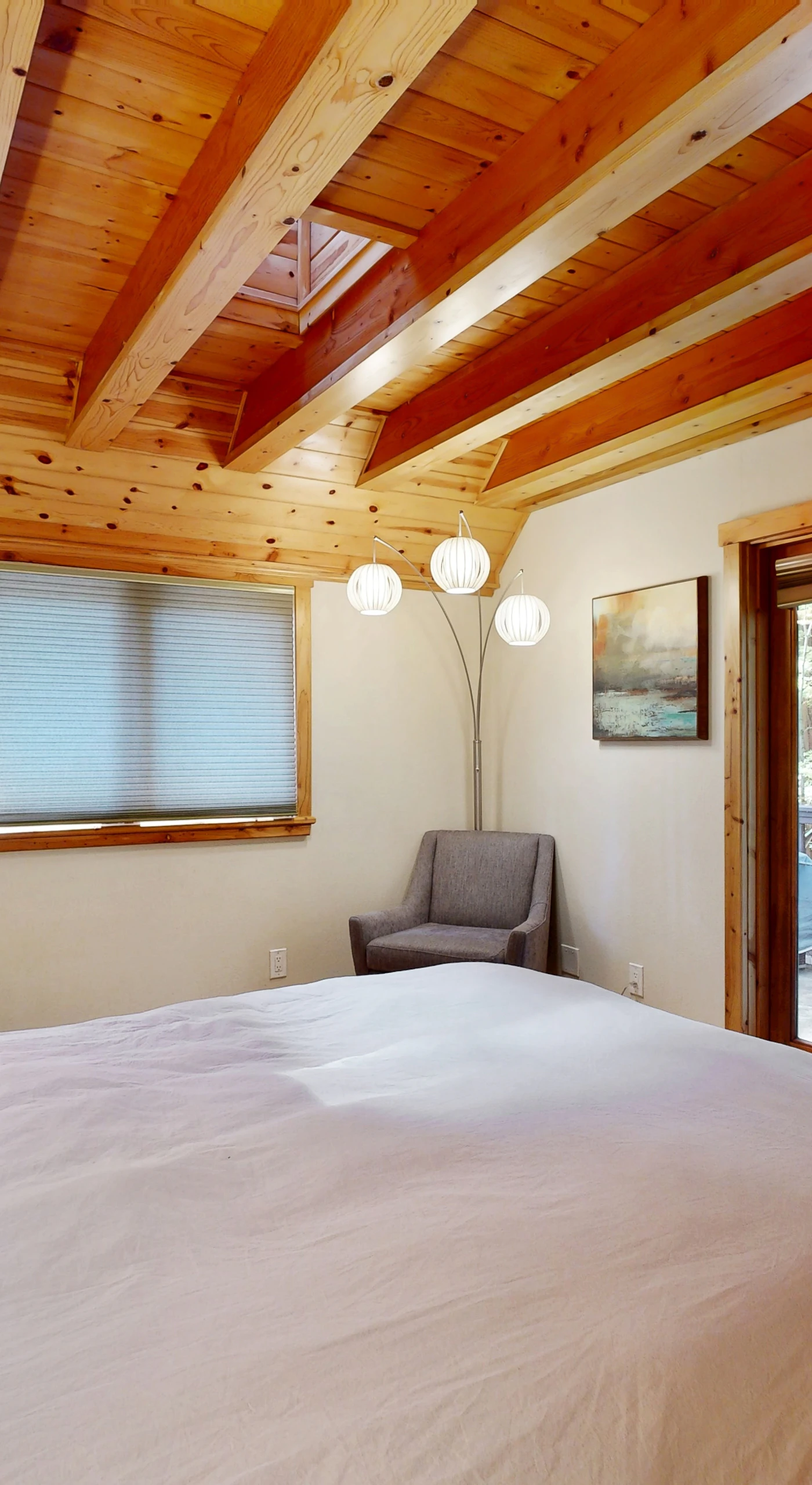 Nestle into your queen bed and gaze through the glass doors at your redwood cathedral — a reading chair beckons for lazy Sonoma County afternoons.