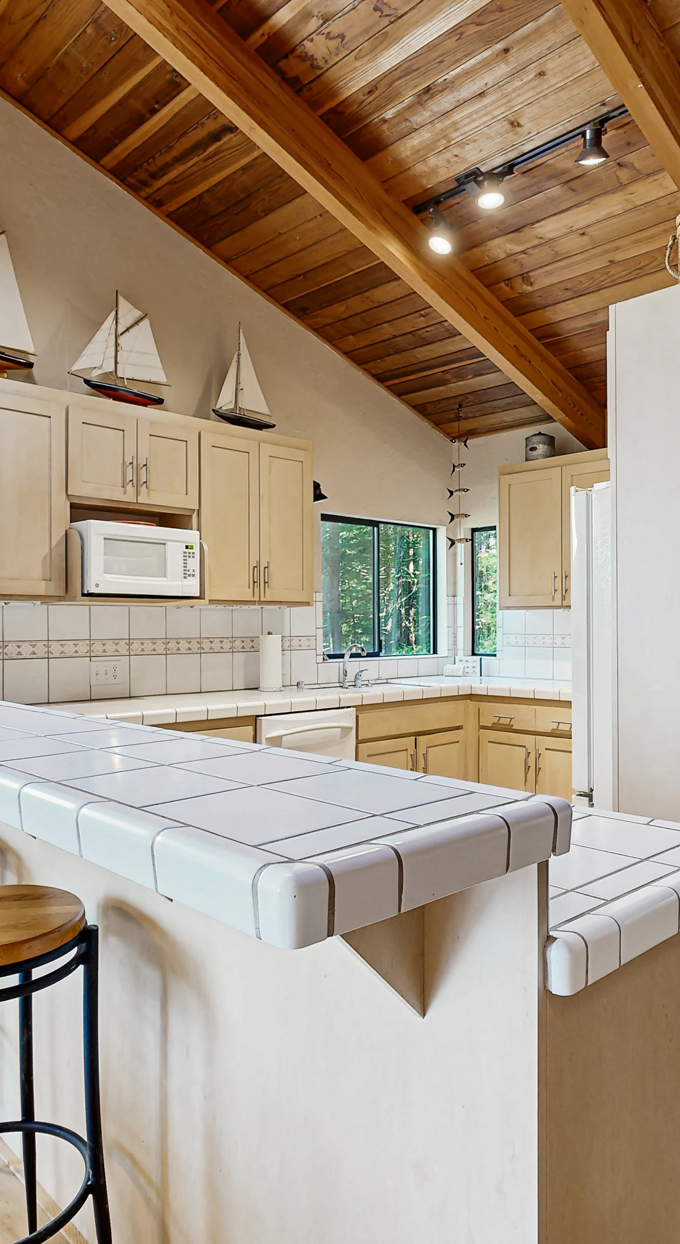 Unleash your culinary creativity in the well-equipped kitchen, where ample counter space makes meal prep a delight.