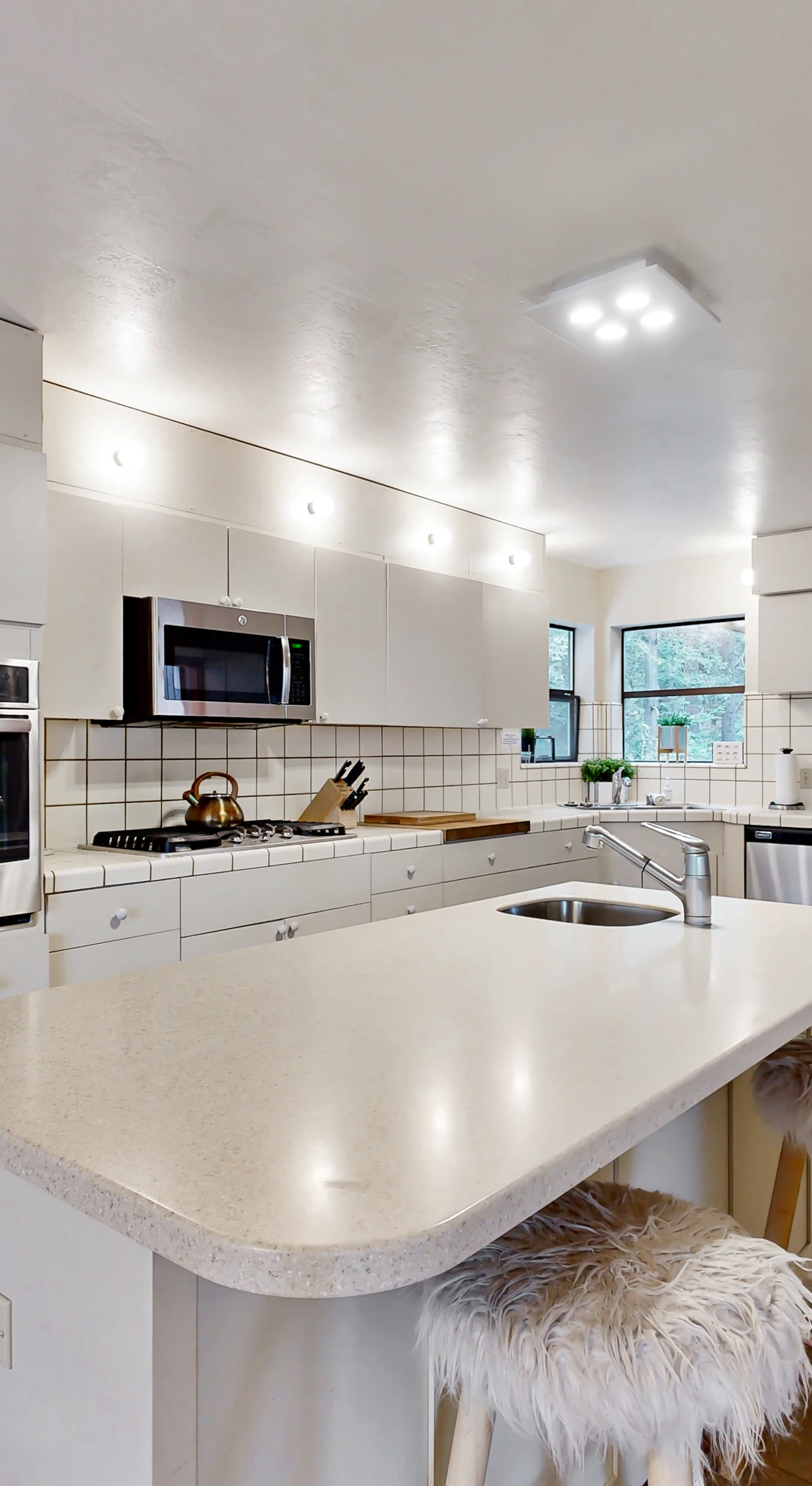Cook up your favorite meals in this modern kitchen, designed for both functionality and style, making mealtime a delightful experience.