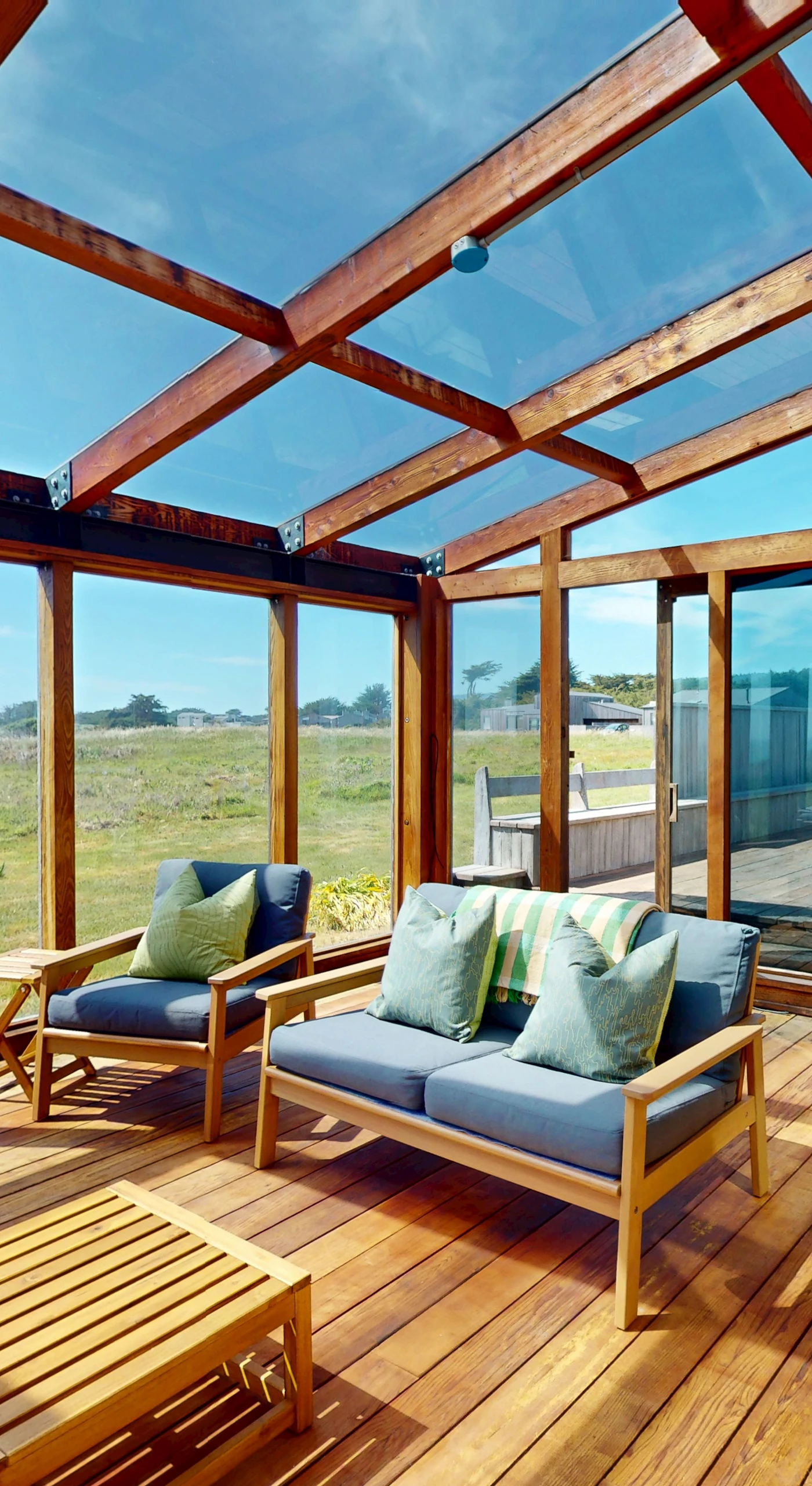 Step onto the sunlit deck, where ocean breezes and stunning vistas invite you to relax with your favorite drink.