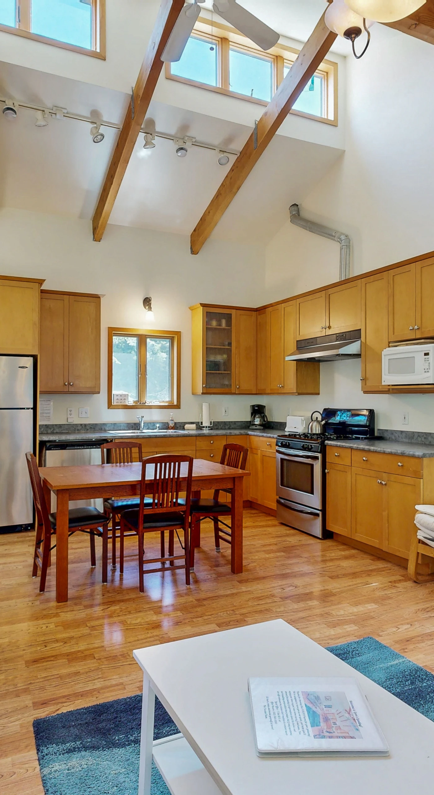 Cook your favorite meals in the spacious kitchen, fully equipped for culinary creations while enjoying the company of friends.