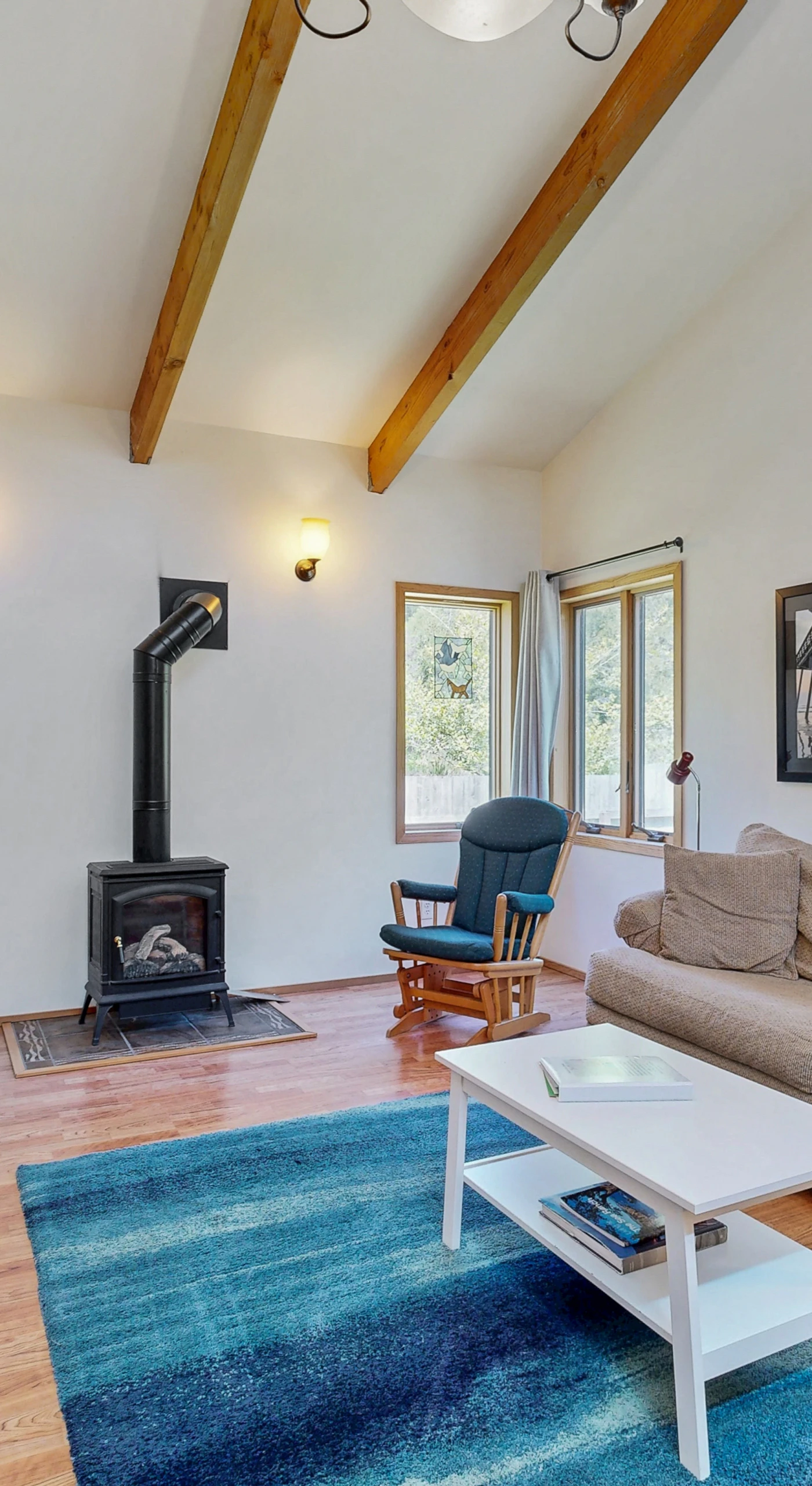Morning light fills the cozy living room, where you can curl up by the gas fireplace with a good book or enjoy a movie night.