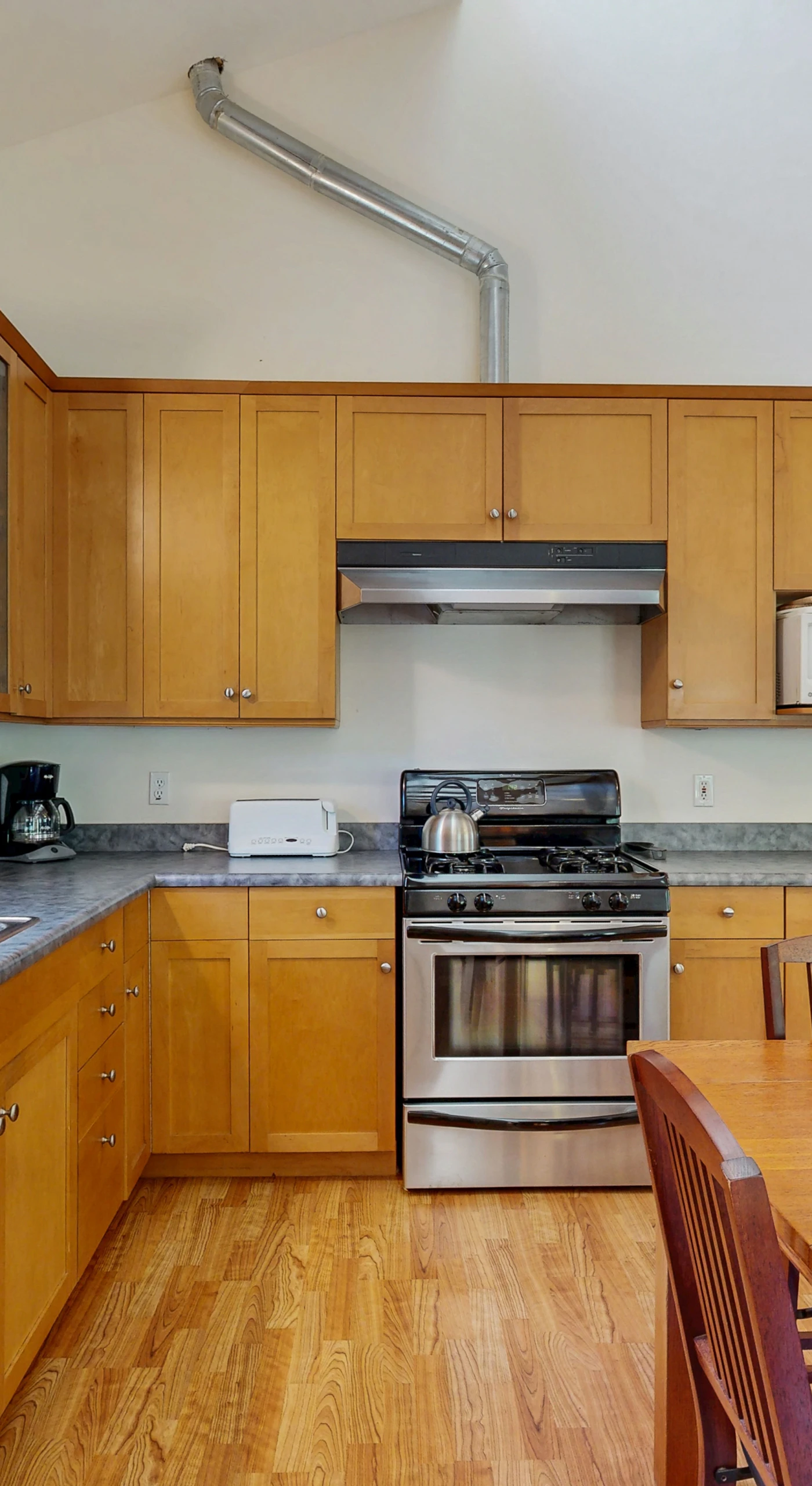 This well-appointed kitchen offers both functionality and warmth, making it the heart of your Sea Ranch retreat.