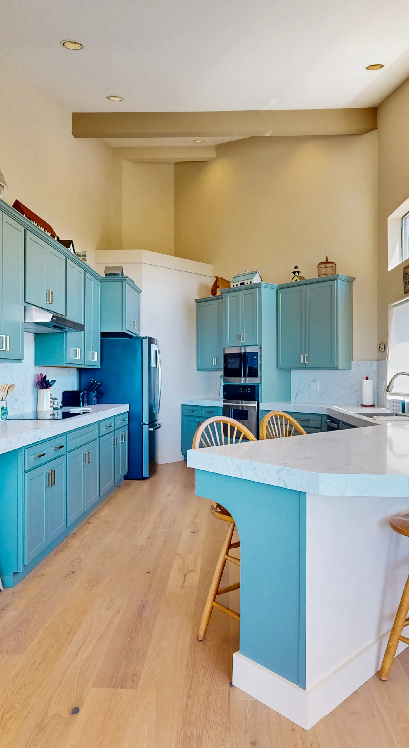 Cook up coastal delights in this bright kitchen, designed for culinary creativity with stunning ocean views as your backdrop.