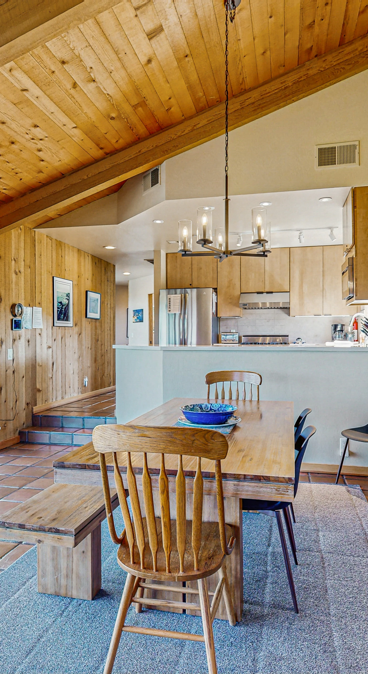 Picture your morning coffee shared at this dining table, with sunlight streaming through the windows, connecting you to the outdoors.