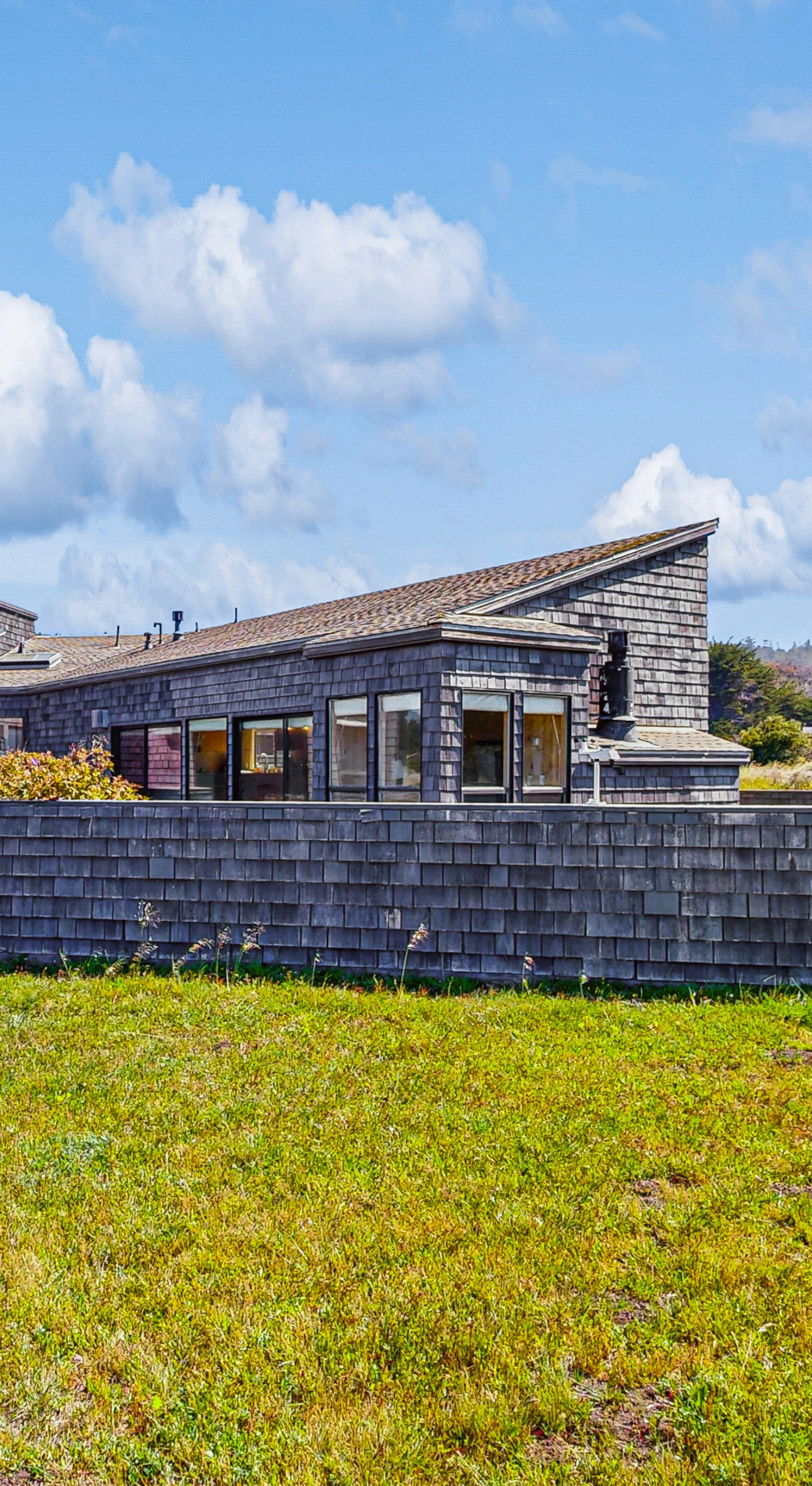 Welcome to Windrow Retreat, where coastal charm meets modern comfort. Your adventure begins here, surrounded by lush green landscapes.