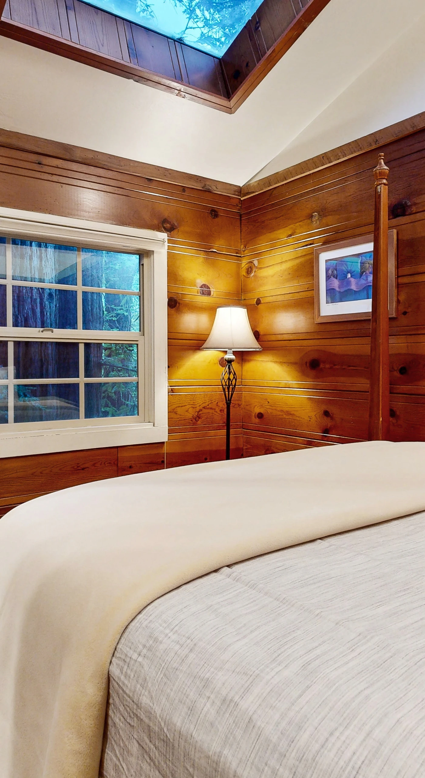 Retreat to your wood-paneled queen bedroom with skylight views of the redwood canopy overhead.