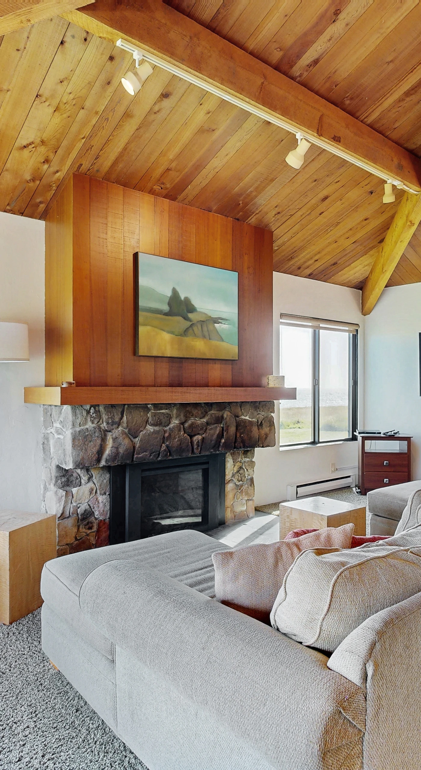 The cozy living room features a perfect blend of comfort and style, designed for cozy evenings and stunning sunset views.