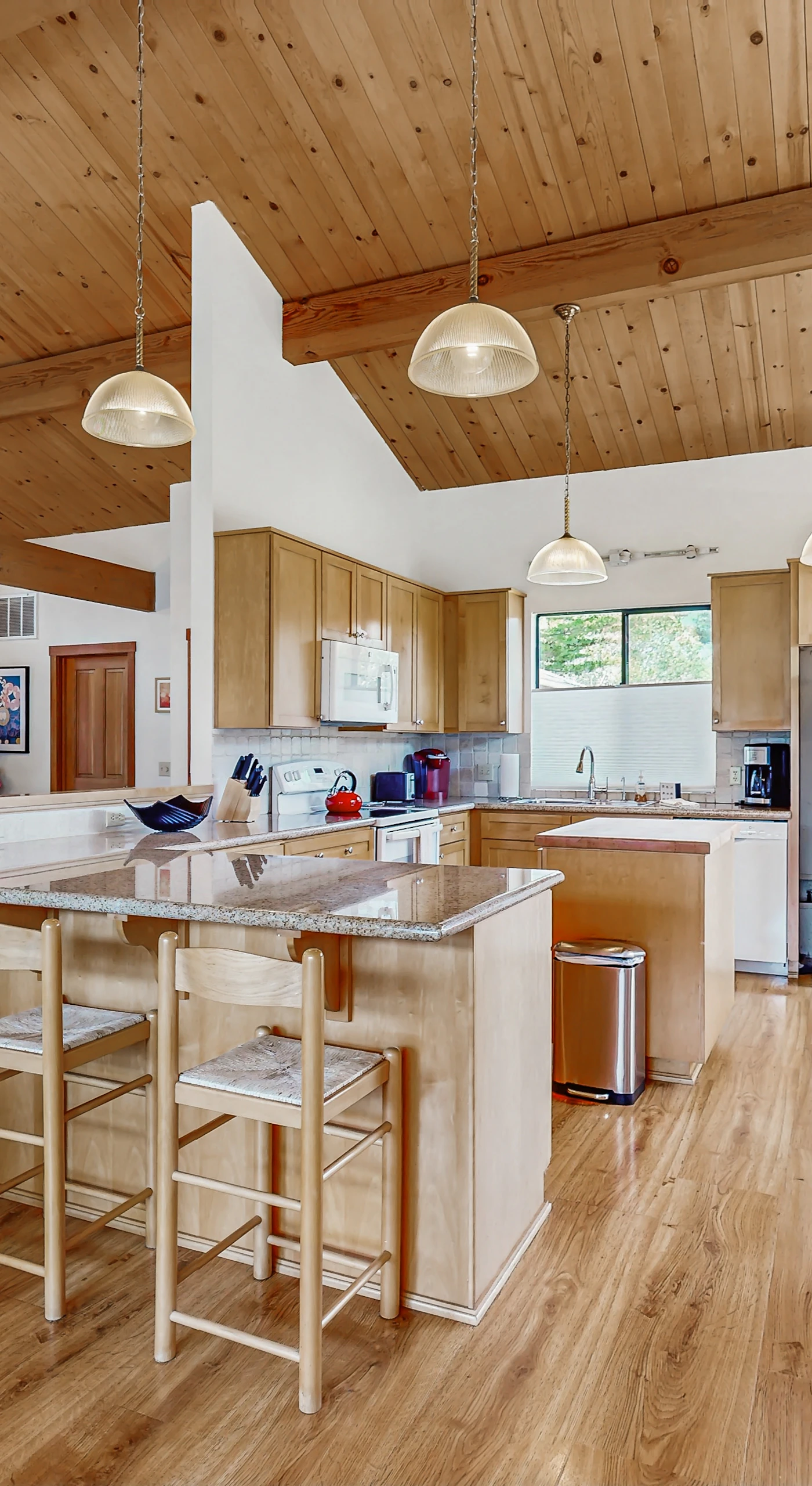 Craft your culinary delights in the spacious kitchen, featuring modern appliances and ample counter space for all your cooking adventures.