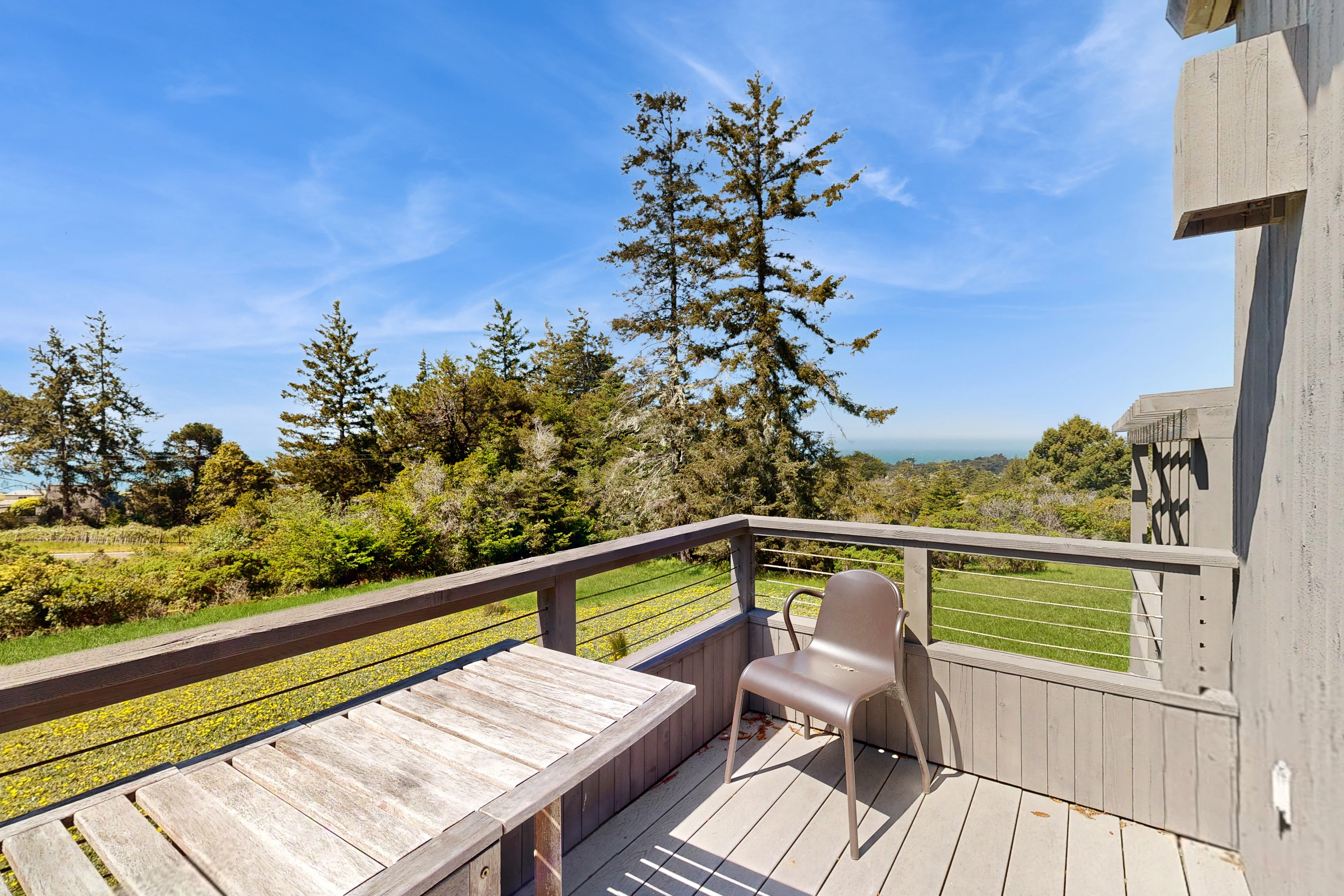 The inviting deck area is perfect for al fresco dining or simply enjoying the tranquility of nature, creating lasting memories with family and friends.