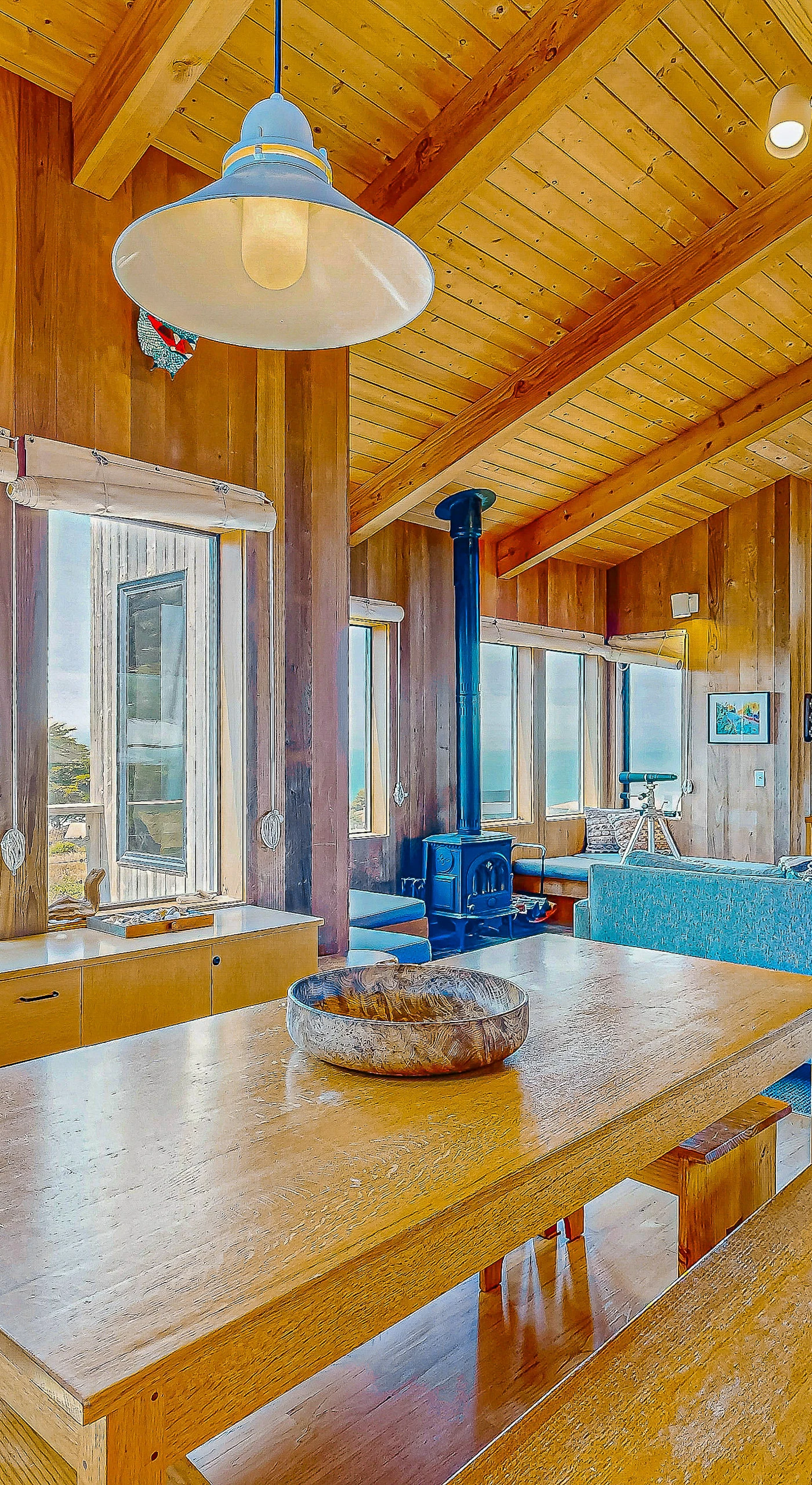 Gather around the fireplace in the living room, a perfect setting for cozy evenings filled with laughter.