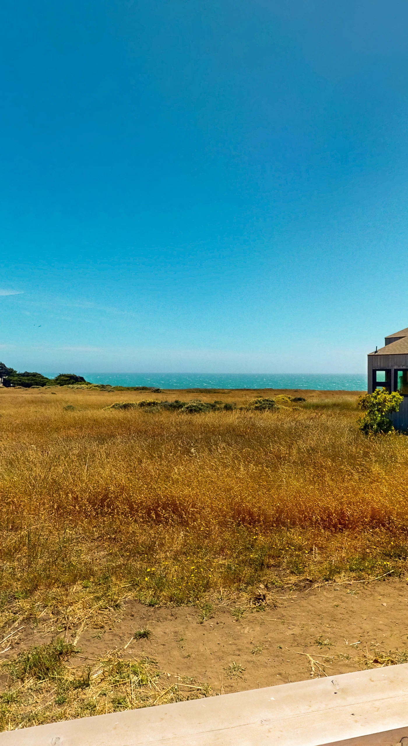 Gaze at the expansive landscape from your deck, where the sound of waves and sea breeze create a peaceful retreat.
