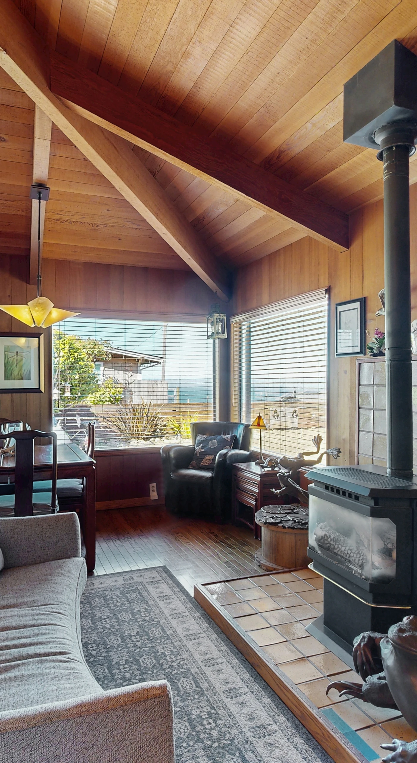 Bask in the warmth of the gas fireplace after a day of exploring, as the inviting living room invites relaxation and connection.
