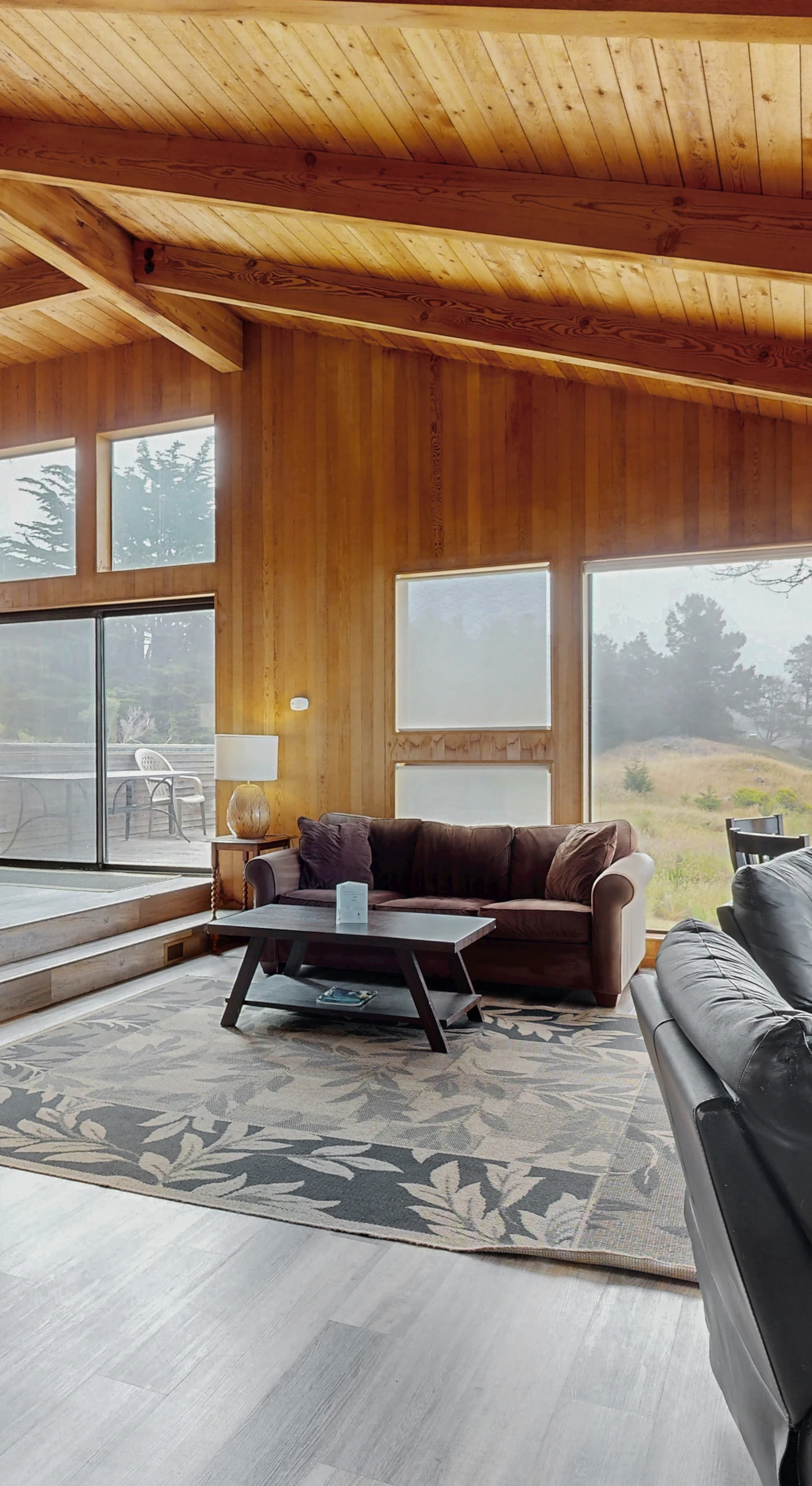 Bask in the warmth of the gas fireplace as you soak in panoramic ocean views from the spacious living room, your perfect retreat after a day of exploration.