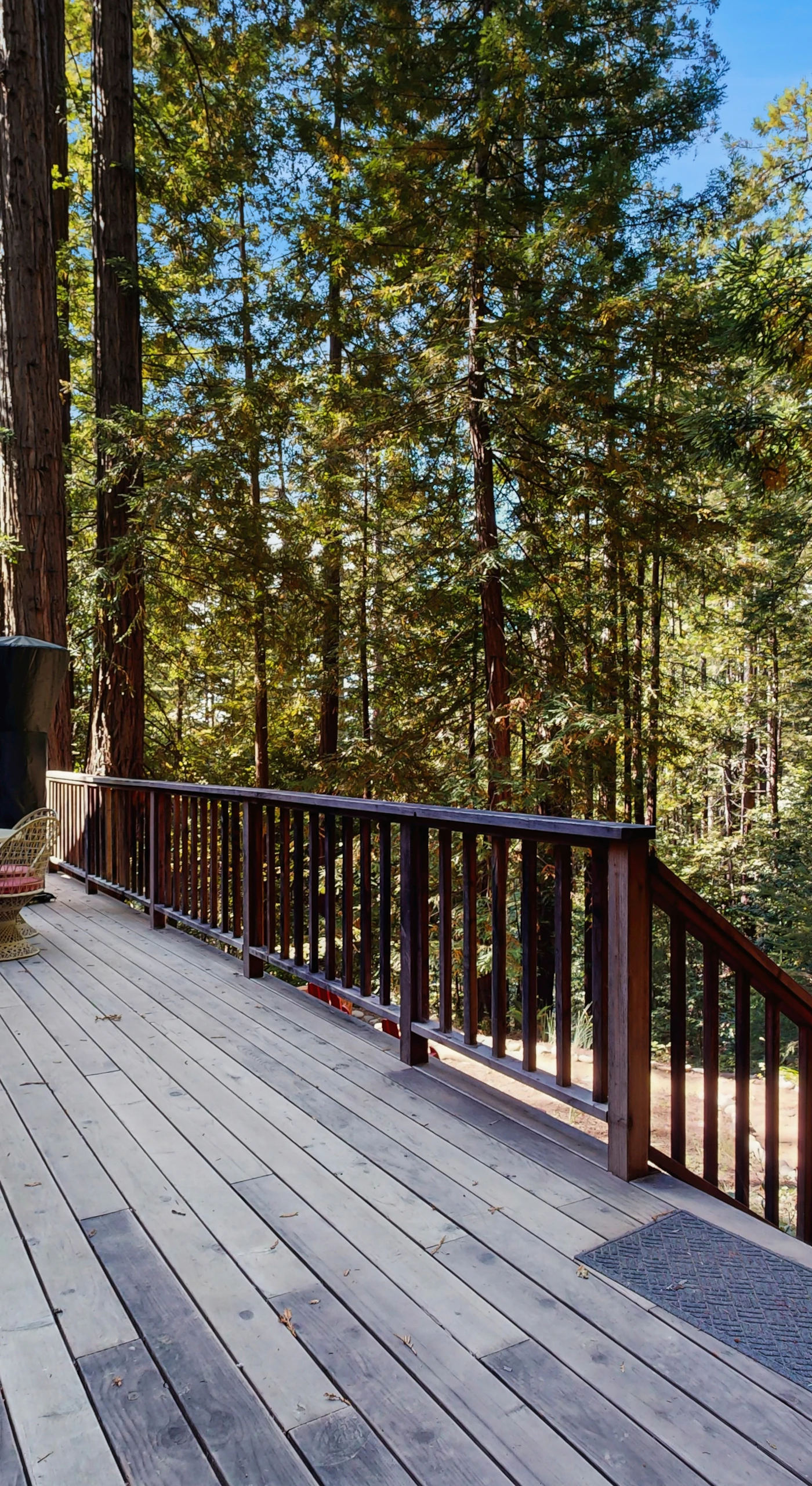 Step onto your expansive deck, where morning coffee meets the whisper of the trees, and evenings are perfect for stargazing.