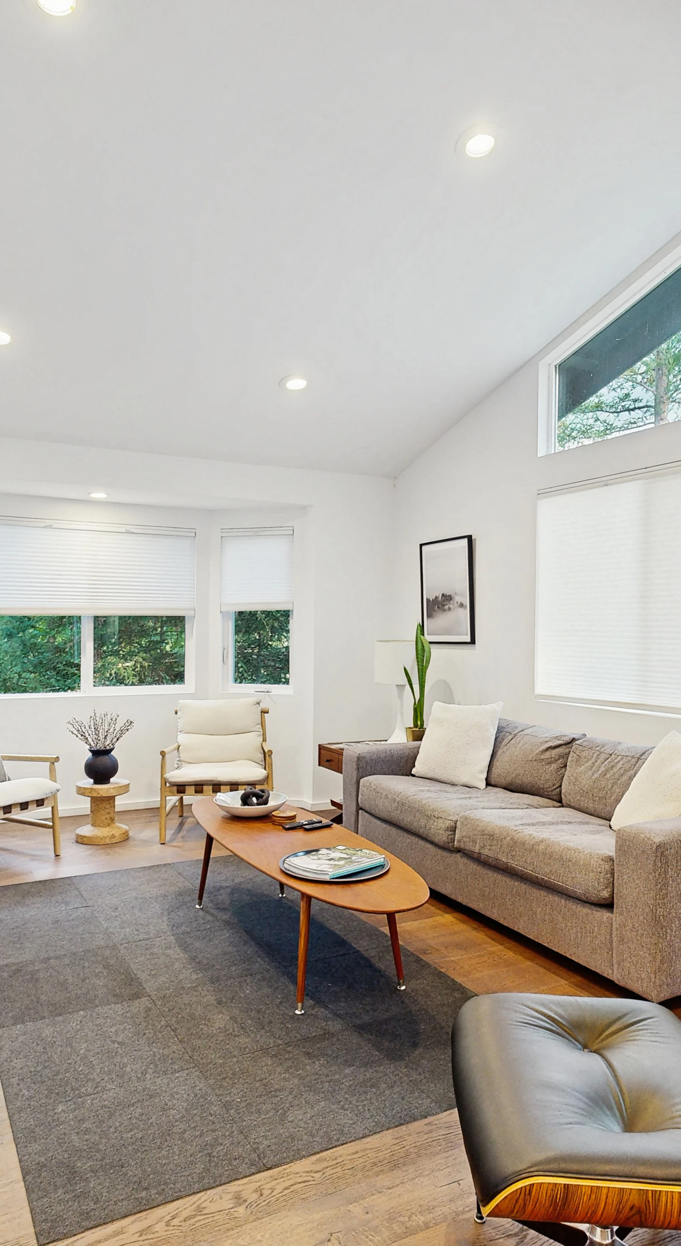 Sunlit living room with soaring ceilings and mid-century furnishings welcomes you after a day exploring Healdsburg's tasting rooms and boutiques.