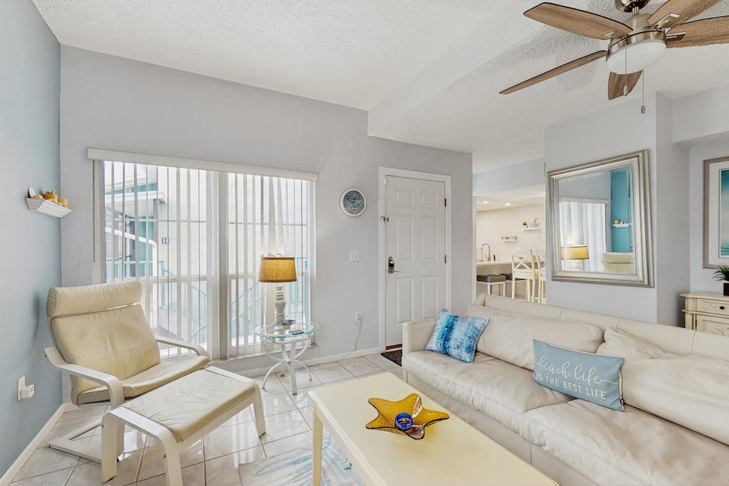 Water view condo with balcony grill heated pool hot tub and sauna walk to beach — Madeira Beach, FL — vacation rental