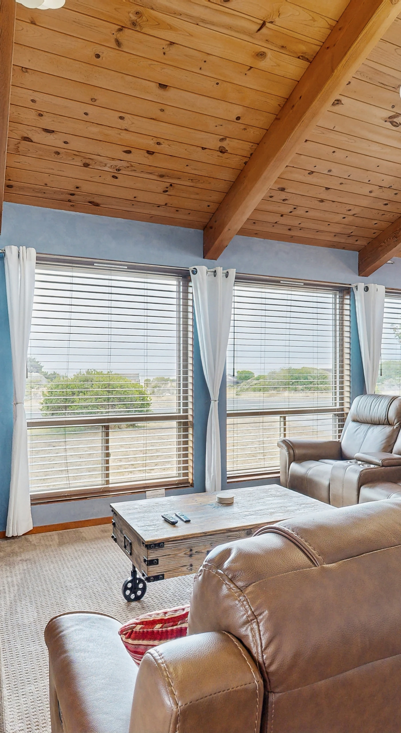 The living room is bathed in natural light, inviting you to curl up with a good book or enjoy a movie night with loved ones.