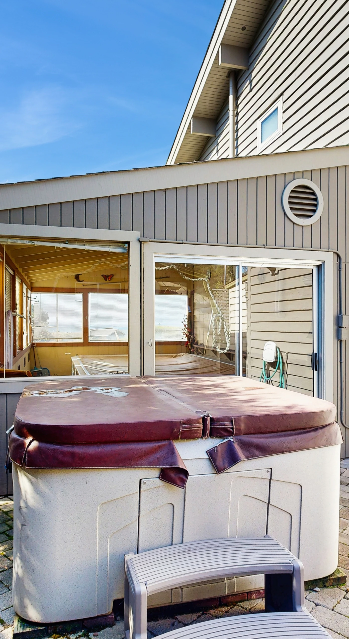 Sink into relaxation in the private hot tub, surrounded by serene coastal views—your personal oasis awaits.