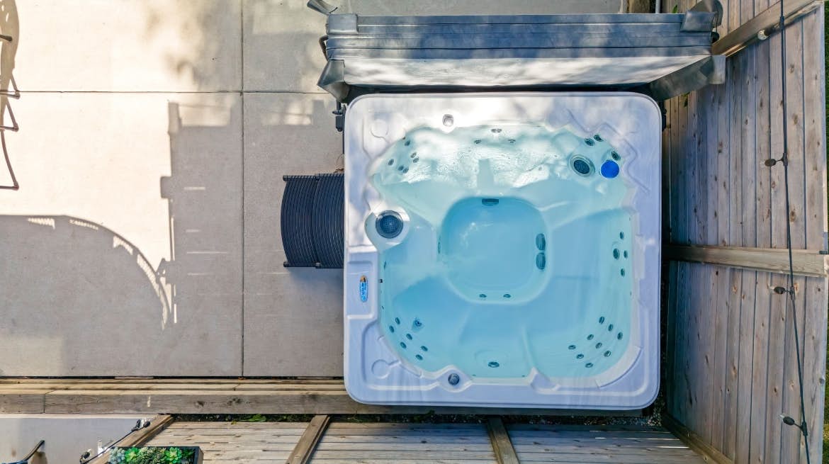 Merchant Street Pool Retreat with a  Year-Round Hot Tub.