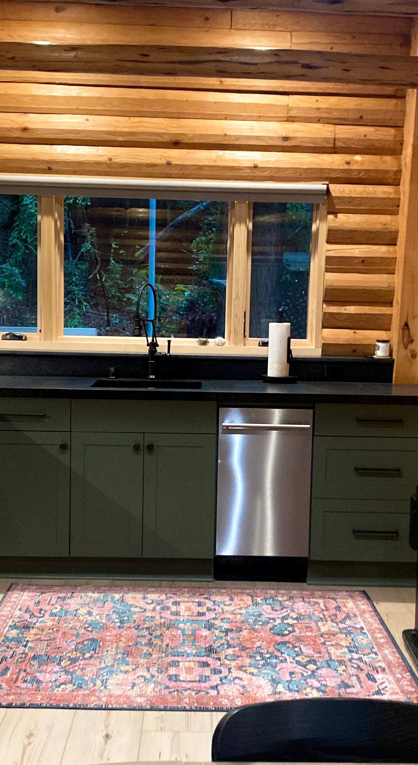 Cook up your favorite meals in this beautifully designed kitchen, where modern appliances meet the warmth of log cabin charm.