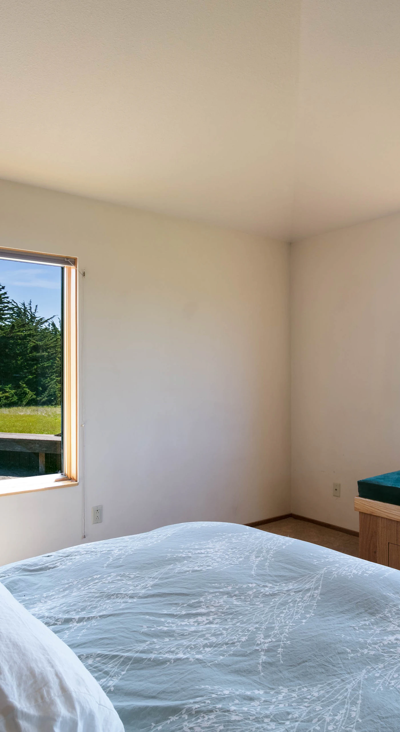 Enjoy bright, airy mornings in this master bedroom, designed for relaxation with spectacular views just outside your window.
