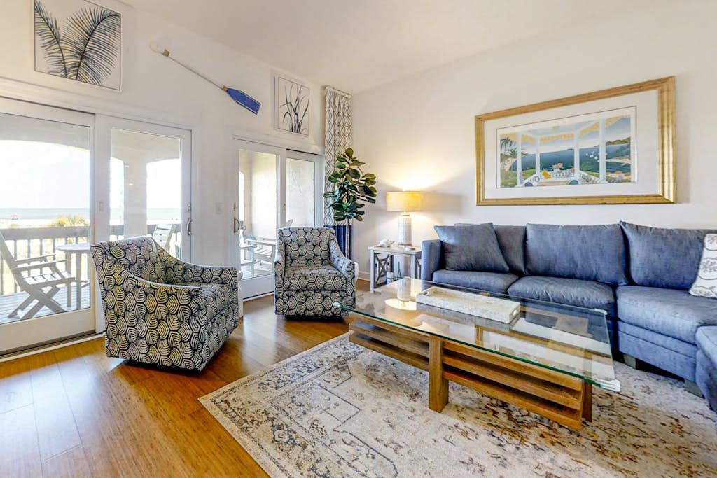 Dog-friendly oceanfront townhouse with covered balcony, views, pool & AC