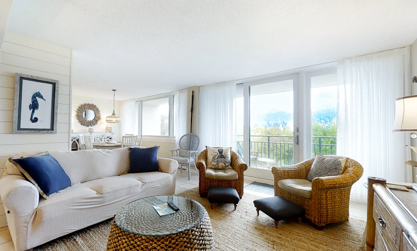 Renovated condo with balcony, lush views, outdoor pool