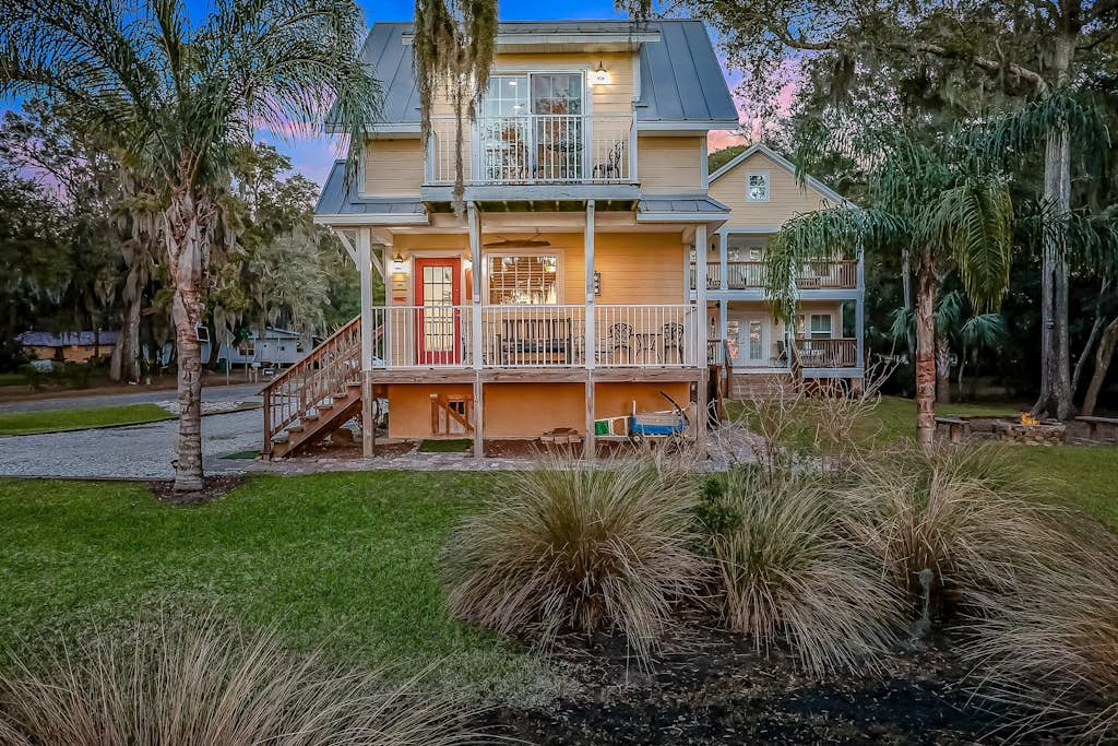 Inviting waterfront cottage w separate garage apartment and stunning marsh view