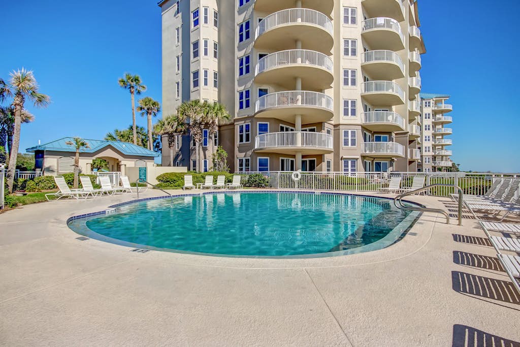 Elegant, oceanfront condo with balcony, washer/dryer & on-site pool