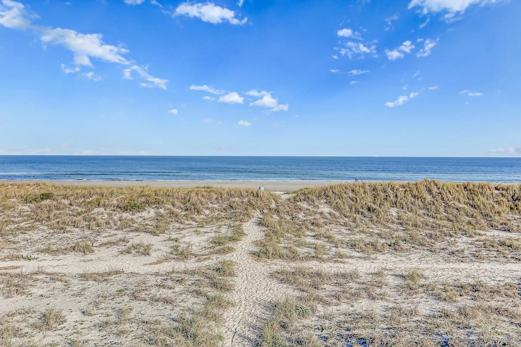 Ground-floor summer beach village condo with a great view plus patio & pool