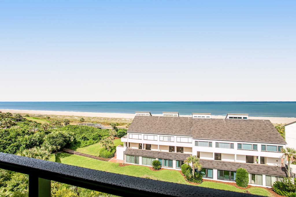 Ocean-view 4th-floor condo with balcony, outdoor pool & central AC