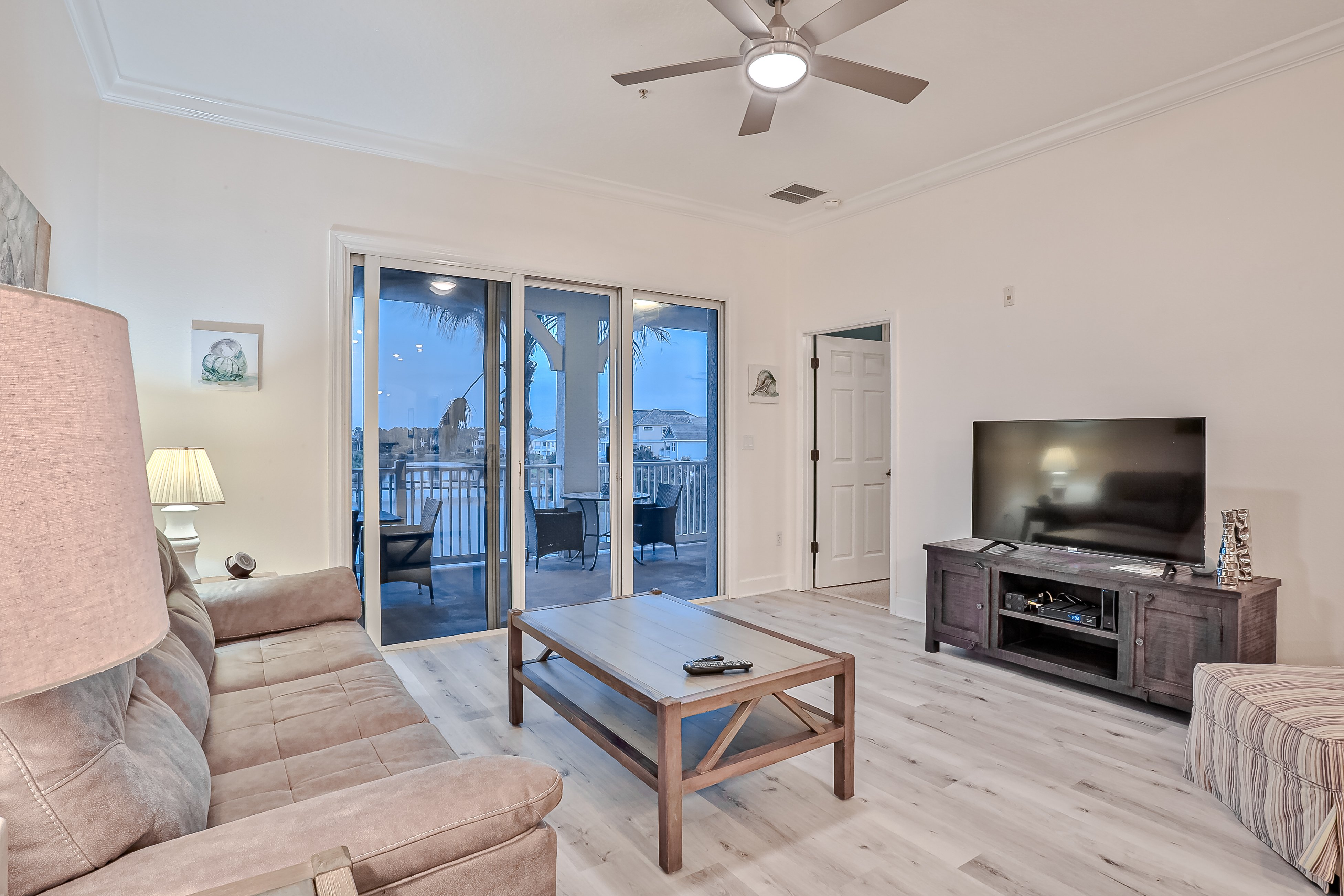 Elegant waterfront condo with central AC, balcony, and shared pools & hot tubs