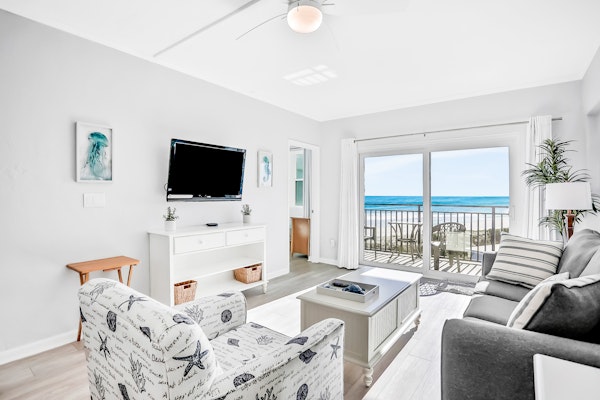 Polished oceanfront condo with pool access, private balcony & washer/dryer