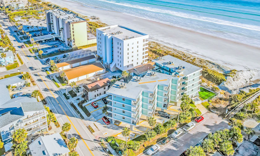 Polished oceanfront condo with pool access, private balcony & washer/dryer