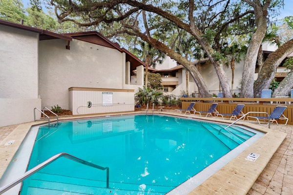 Ground floor condo with private patio, full kitchen, beach access and pool