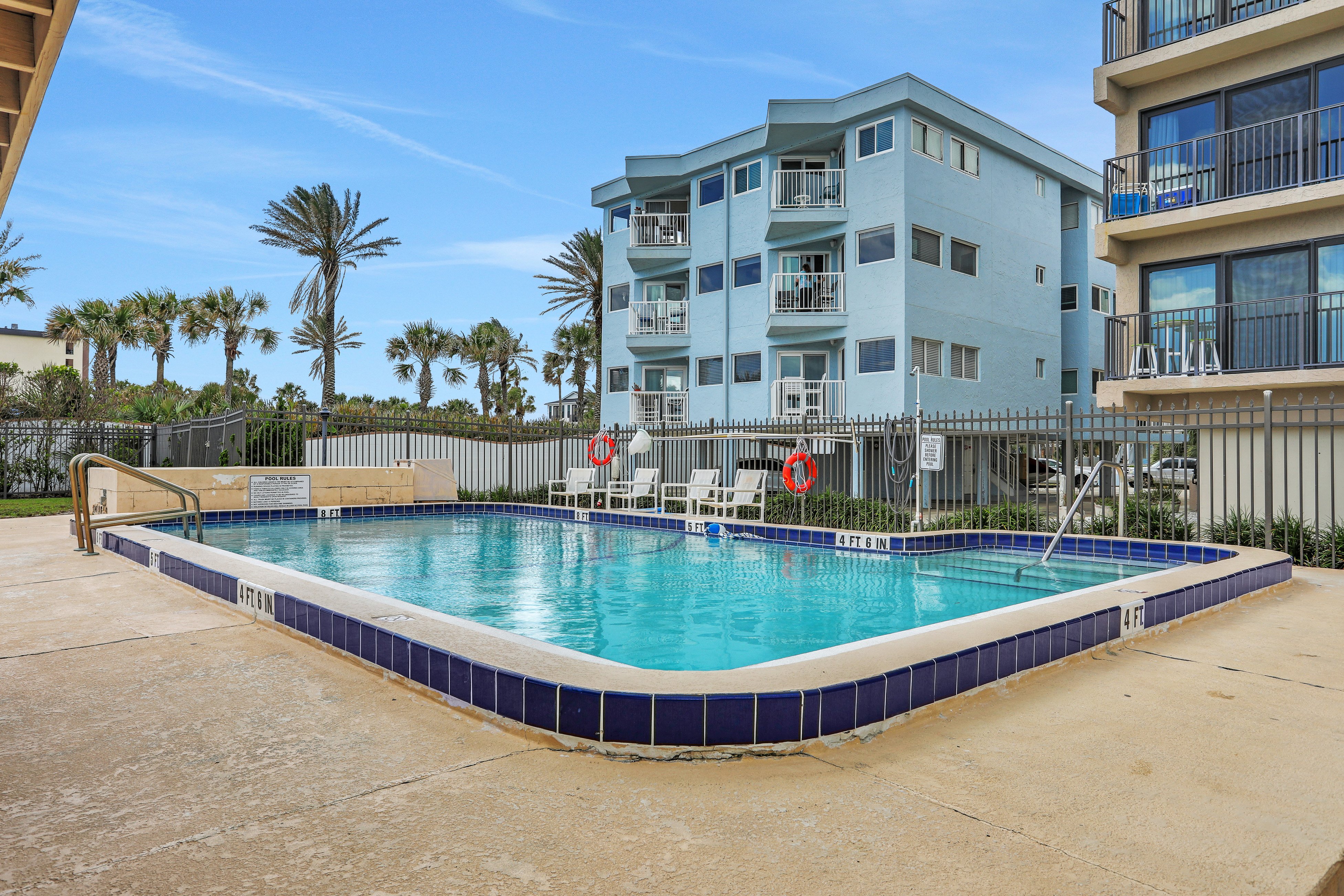 Renovated condo with ocean views, pool, & beach access