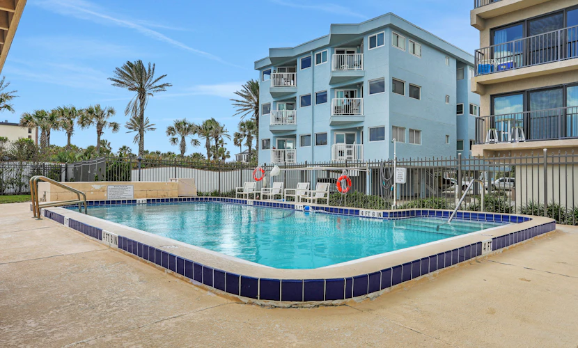 Renovated condo with ocean views, pool, & beach access