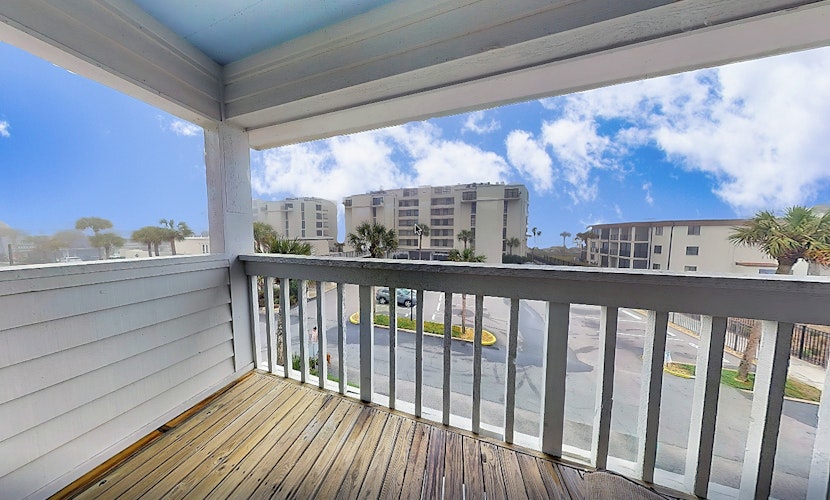 Ocean-view townhome with balcony & W/D - walk to beach - dog-friendly