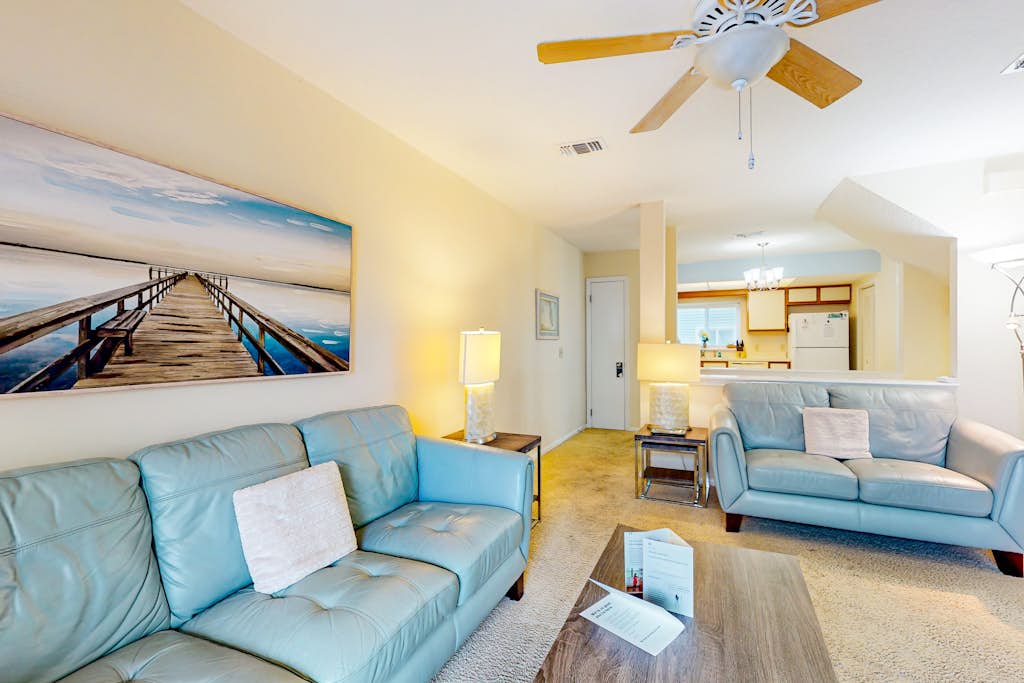 Ocean-view townhome with balcony & W/D - walk to beach - dog-friendly