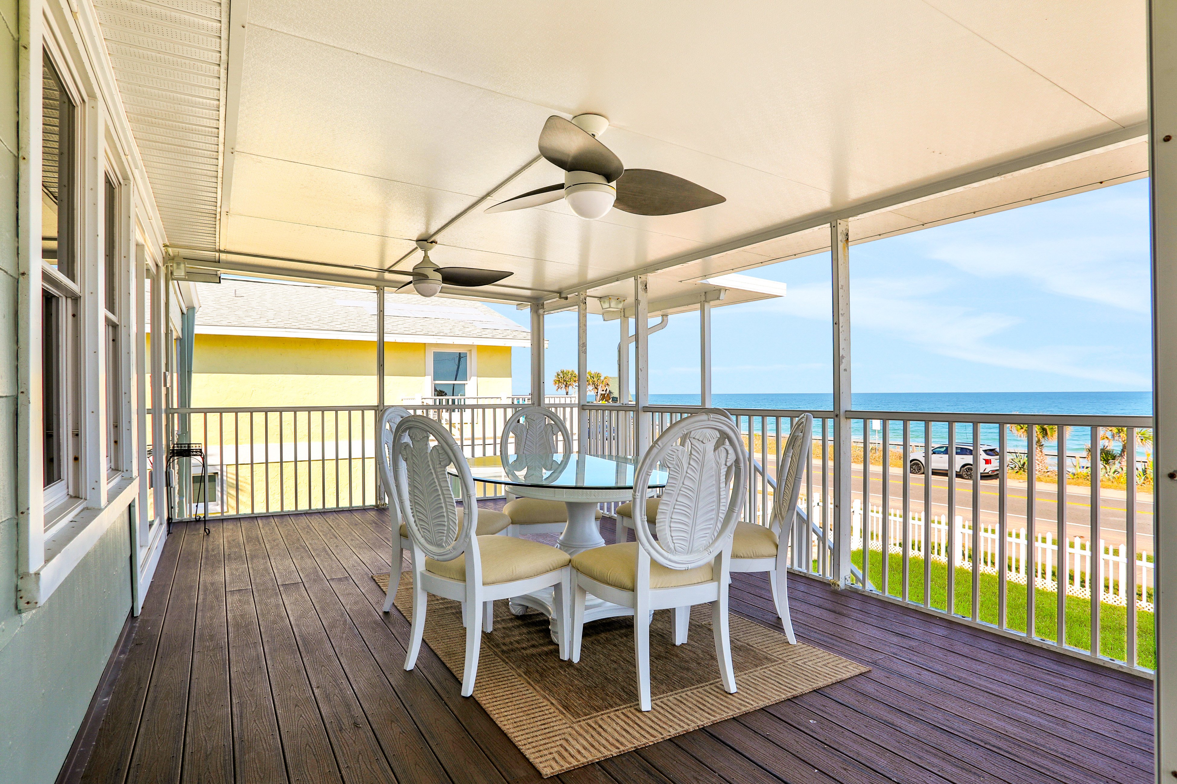 Updated home across from beach with covered balcony, central AC, & washer/dryer