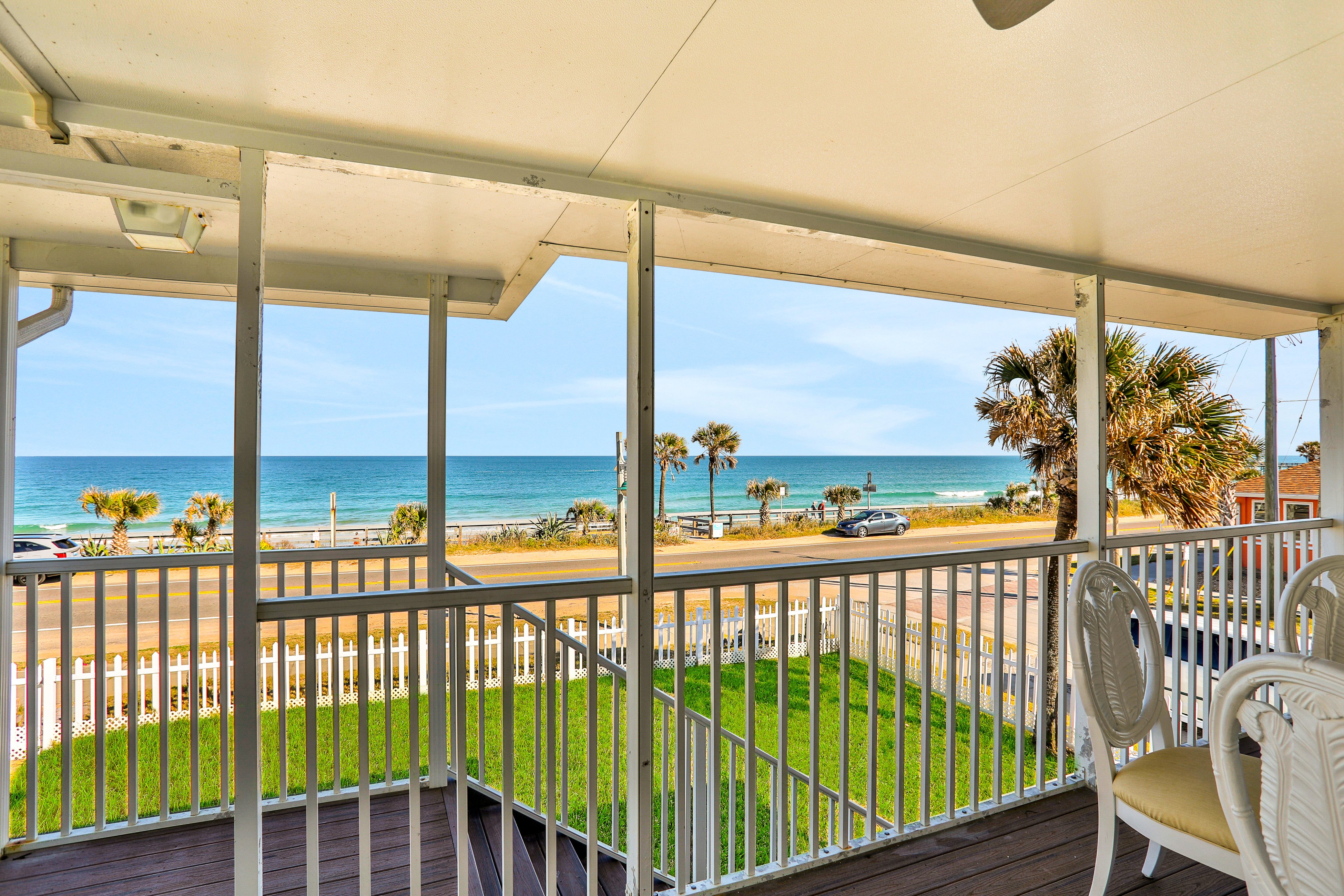 Updated home across from beach with covered balcony, central AC, & washer/dryer