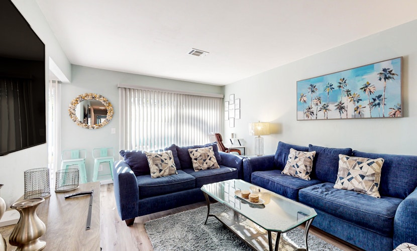 Water-view dog-friendly home with outdoor space & entertainment options