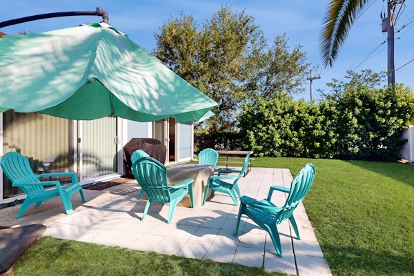 Water-view dog-friendly home with outdoor space & entertainment options