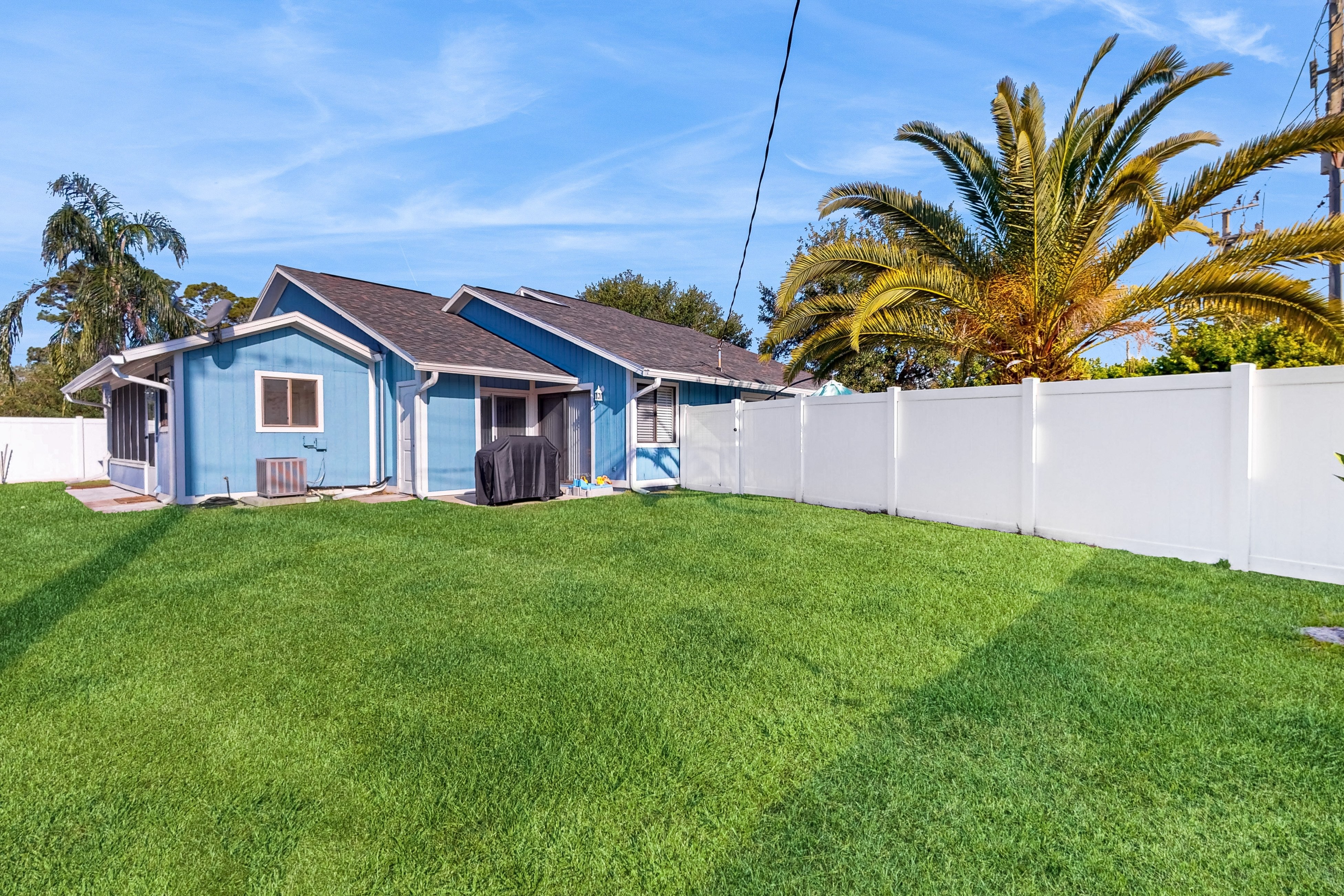 Water-view dog-friendly home with outdoor space & entertainment options