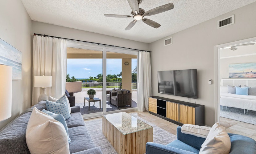 Oceanfront condo with large patio, direct water access, pool, central AC, & W/D