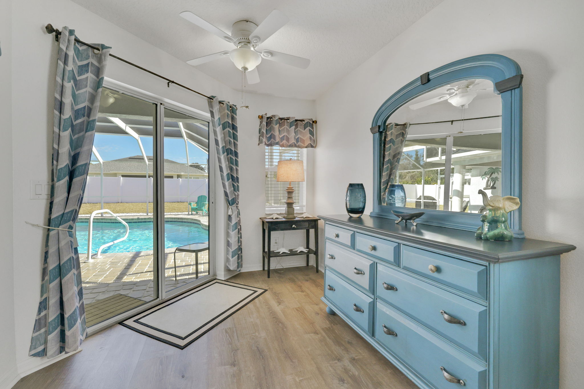 Contemporary coastal escape with heated pool, fenced yard, & outdoor dining