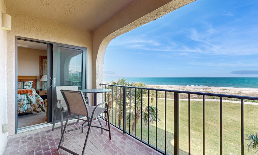 Oceanfront condo with panoramic views, shared pool, and private washer & dryer