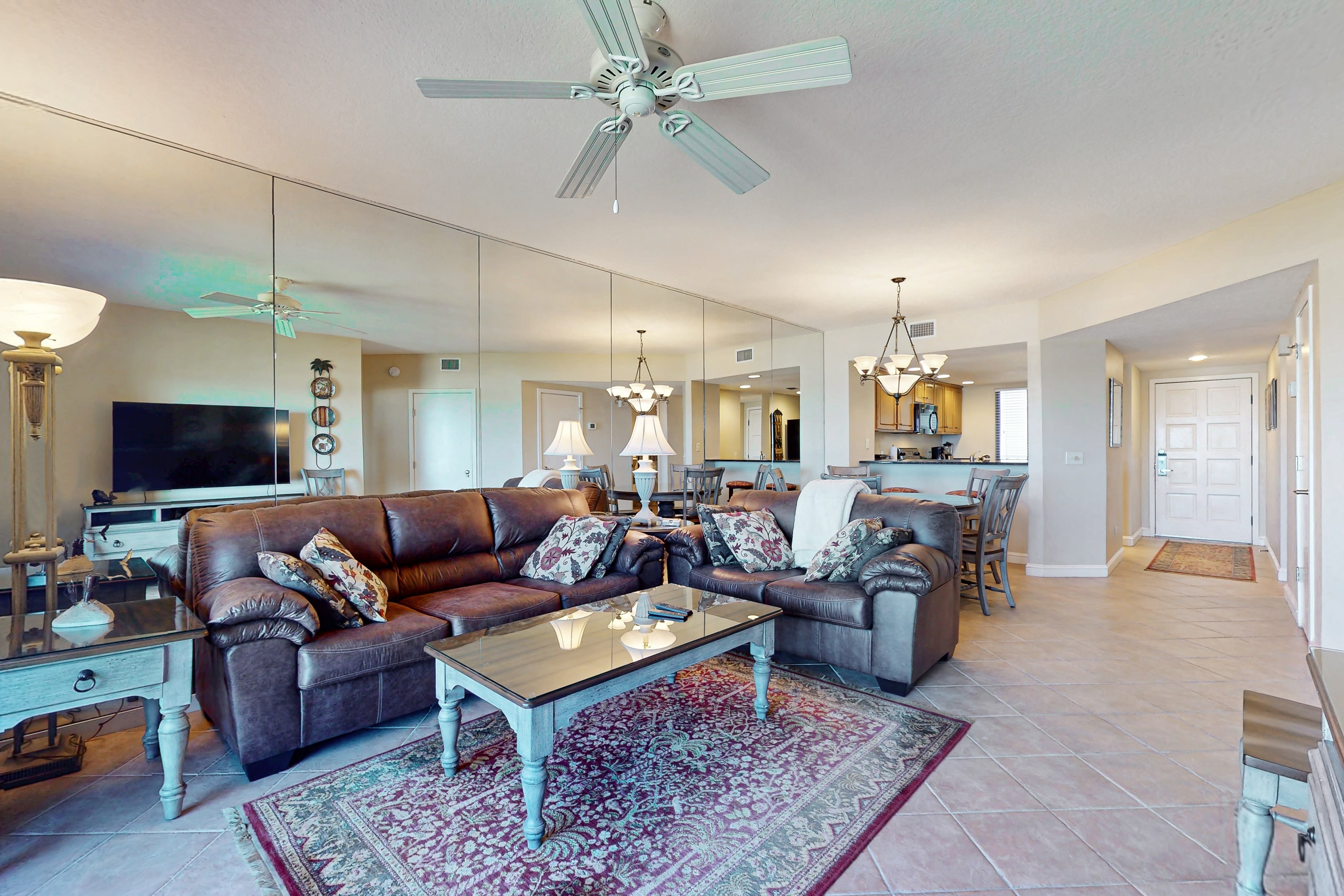 Oceanfront condo with panoramic views, shared pool, and  private washer & dryer