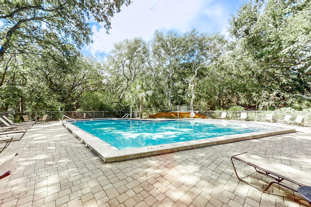 2-story condo with on-site pool, private patio, & W/D - near beach/golf